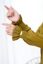 Stylish Hand Gesture and Sleeves Showing The Beautiful Asian Hijab Woman Hand