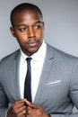 Stylish handsome black male in modern fashion suit and tie looking elegant