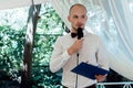 Stylish handsome emcee performing speech for toast at wedding re Royalty Free Stock Photo