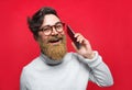 Man with golden beard talking on phone