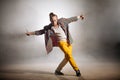 Stylish handsome man doing dancing steps on the street Royalty Free Stock Photo