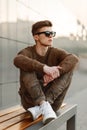 Stylish handsome man in sunglasses in a sweater Royalty Free Stock Photo