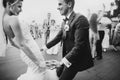 Stylish happy bride and groom having fun and dancing at wedding reception. Gorgeous wedding couple of newlyweds having first dance Royalty Free Stock Photo