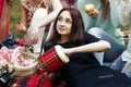 Stylish happy group of women eating fruits and having fun smiling on picnic, joyful moments in summer park Royalty Free Stock Photo