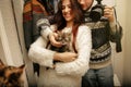 Stylish hipster couple adopted homeless sweet little kitten and Royalty Free Stock Photo