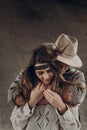 stylish hipster couple gently hugging. man in hat sensual touching boho woman in knitted sweater. atmospheric sensual moment. Royalty Free Stock Photo