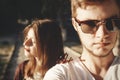 Stylish hipster couple making selfie and embracing in sunlight. Happy family couple in love making self portrait and posing in Royalty Free Stock Photo