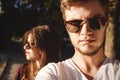 Stylish hipster couple making selfie and embracing in sunlight. Happy family couple in love making self portrait and posing in Royalty Free Stock Photo