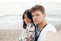 Stylish hipster couple taking selfie on beach at evening sea. Summer vacation. Portrait of happy young family on honeymoon on Royalty Free Stock Photo