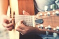 Man`s hands playing acoustic guitar Royalty Free Stock Photo