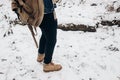 Stylish hipster traveler with backpack walking in nubuk shoes in