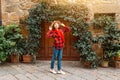 Hipster traveller woman posing in old town of Pienza, Tuscany