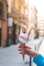 Stylish hipster woman holding an ice cream in her hand. Bright summer day in italian city Royalty Free Stock Photo