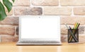 Stylish home studio workspace with laptop and supplies Royalty Free Stock Photo