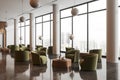 Stylish hotel interior lobby with soft armchairs and coffee table, window Royalty Free Stock Photo