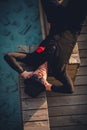 Stylish and independent man lying in the shade