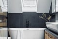 Stylish interior of bathroom with bathtub, shower, towels and other personal bathroom accessories. Modern and design interior Royalty Free Stock Photo