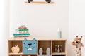 Cute interior of kid room with baby accessories and toys. Royalty Free Stock Photo