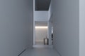 Stylish interior of hallway with firm and geometric lines and forms. Minimalism and constructivism concept. White wall