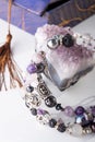 Stylish jewelry bracelet with semiprecious and amethyst  crystal around  white background. hobby and fashion concept. close up Royalty Free Stock Photo