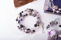 Stylish jewelry bracelets with semiprecious and amethyst crystal at white background. hobby and fashion concept. close up Royalty Free Stock Photo