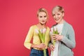 stylish, joyful mother and daughter holding