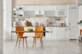 Stylish kitchen interior with dining table Royalty Free Stock Photo