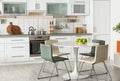 Stylish kitchen interior with dining table Royalty Free Stock Photo