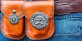 Stylish Leather Belt Pouches Adorned With Antique Emblems on Jeans for a Unique Look Royalty Free Stock Photo