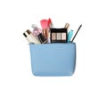 Stylish light blue cosmetic bag with makeup products on white background, top view Royalty Free Stock Photo