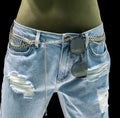 Stylish light blue jeans with chain accessories and sunglasses o Royalty Free Stock Photo