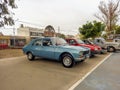 stylish light blue Peugeot 504 sedan family car 1969-1999 in a park