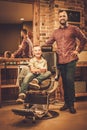 Stylish little boy and his father Royalty Free Stock Photo