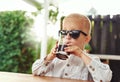 Stylish little boy wearing trendy sunglasses Royalty Free Stock Photo