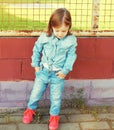 Stylish little girl child in the jeans clothes Royalty Free Stock Photo