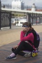 Stylish little girl child riding skateboard in city Royalty Free Stock Photo