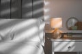 Stylish living room interior with bed, bedside table and lamp Royalty Free Stock Photo