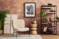 Stylish living room interior design with mock up poster frame frotte armchair, black metal shelf, side table, plants. Royalty Free Stock Photo