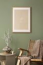 Stylish living room interior design with mock up poster frames, rattan armchair, coffe table, beige carpet and creative home Royalty Free Stock Photo