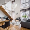 Stylish living room with wooden stairs