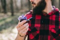 Stylish lumberjack holding a pipe for smoking Royalty Free Stock Photo