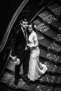 Stylish luxury bride and handsome elegant groom on old wooden st