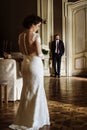 Stylish luxury bride and handsome elegant groom posing on the ba