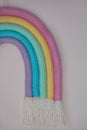 Stylish macrame rainbow decoration for baby room. Wall