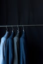 stylish male suit jackets on hangers Royalty Free Stock Photo