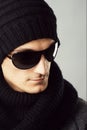 Stylish man in dark sunglasses and black clothing