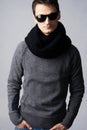 Stylish man in dark sunglasses and black scarf