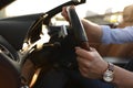 Stylish man driving luxury convertible car, closeup Royalty Free Stock Photo