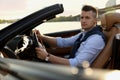 Stylish man driving luxury convertible car Royalty Free Stock Photo