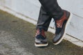 Stylish man in gray check suit pants and tricolor leather brogue shoes